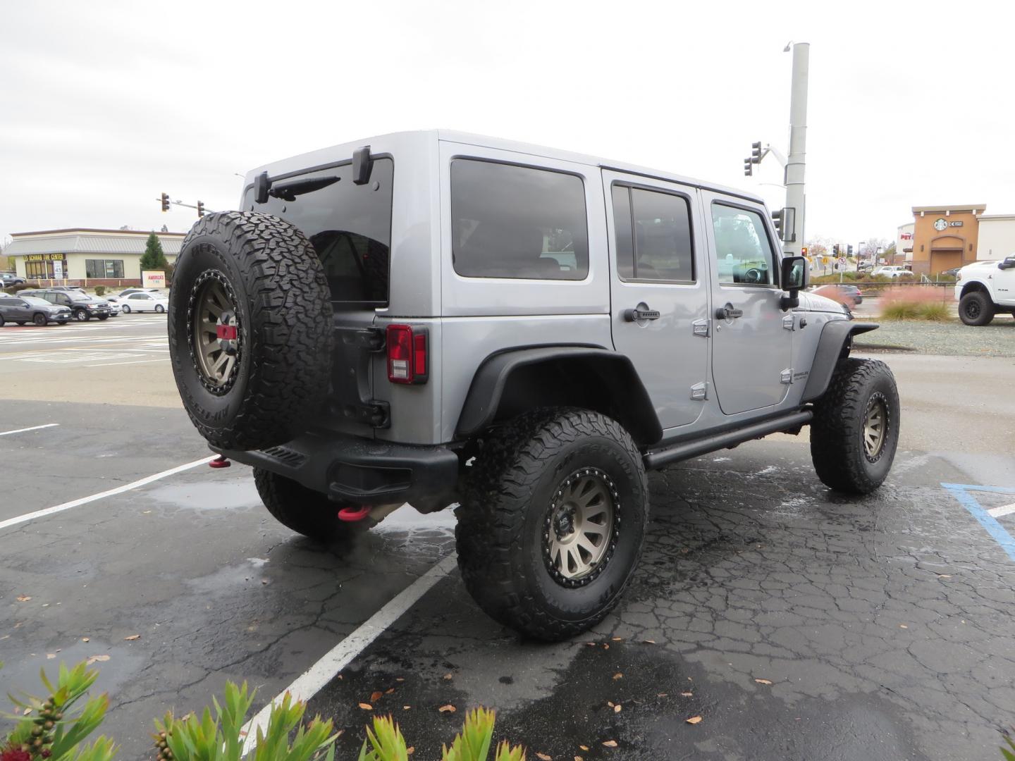 2017 SILVER /BLACK Jeep Wrangler Unlimited Rubicon 4WD (1C4BJWFG3HL) with an 3.6L V6 DOHC 24V FFV engine, automatic transmission, located at 2630 Grass Valley Highway, Auburn, CA, 95603, (530) 508-5100, 38.937893, -121.095482 - Rubicon sitting on a Teraflex suspension system, Falcon shocks, 37" BFG KO2 tires, 17" Hardrock wheels, RC Fender Flares, and AMP steps. - Photo#4